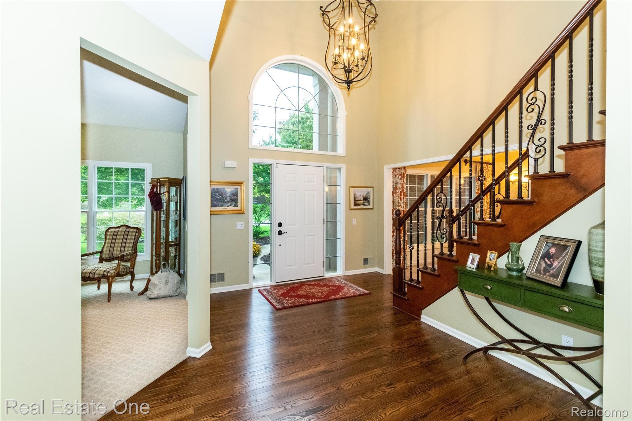 3959 Kaeleaf Road Lake Orion, MI 48360 - Photo 8 of 43 Spacious Foyer staircase with iron baluster's