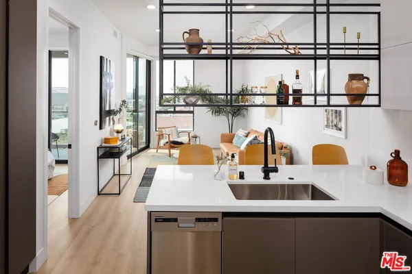 a view of living room with furniture a window and appliances