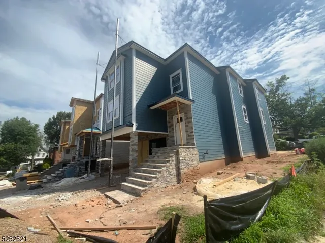 a backyard of a house with outdoor seating