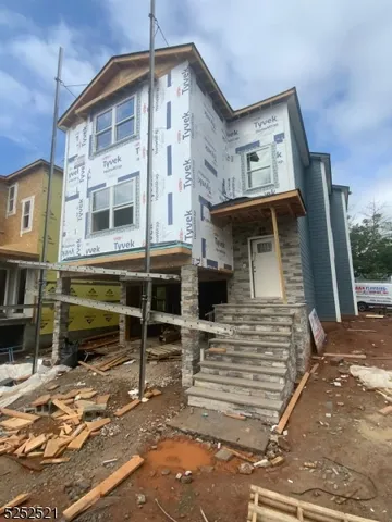 a front view of a house with stairway