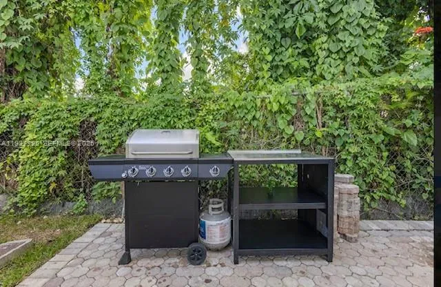 a wooden bench sitting in front of a building