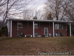 855 Cortez Road Lake Ariel, PA 18436 - Photo 1 of 1 a front view of house with yard