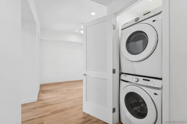 a view of a hallway with washer and dryer