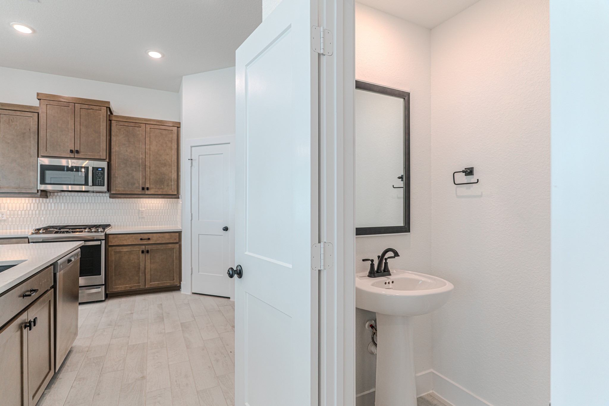 152 Red Cascade Trail Willis, TX 77318 - Photo 20 of 39 a bathroom with a sink double vanity and a mirror