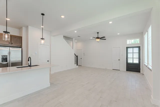 a bathroom with a shower sink and mirror