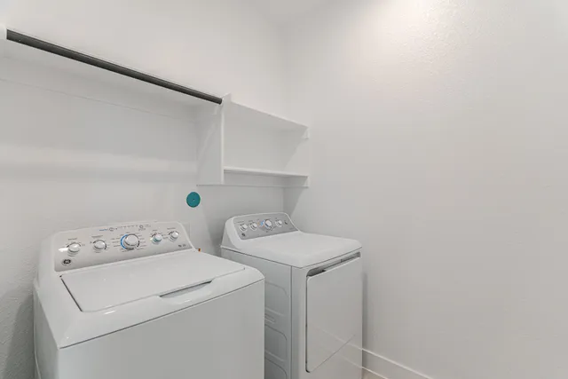 a spacious bathroom with a tub sink and mirror