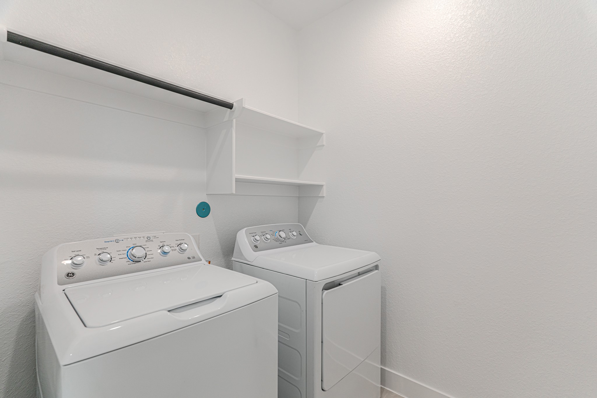 152 Red Cascade Trail Willis, TX 77318 - Photo 27 of 39 a utility room with dryer and washer