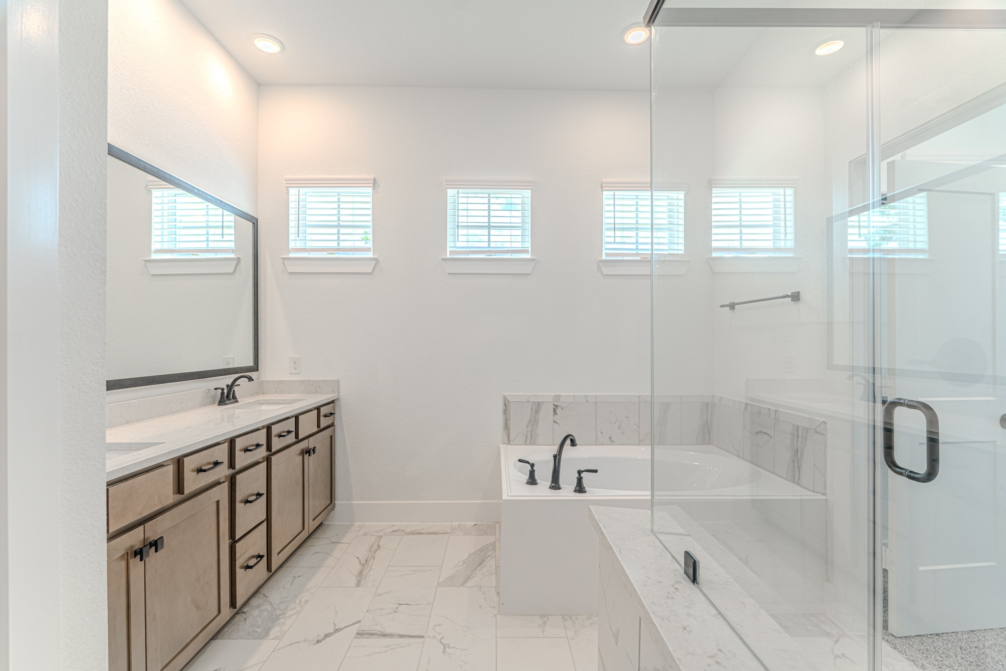 152 Red Cascade Trail Willis, TX 77318 - Photo 29 of 39 a spacious bathroom with a tub sink and mirror