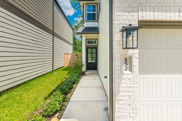 a view of a pathway of a house with backyard
