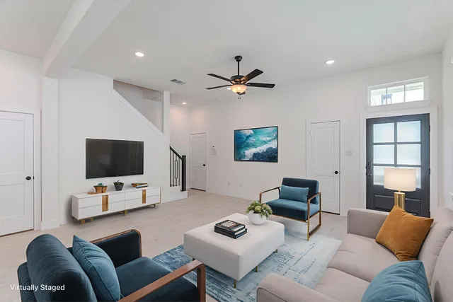 a living room with furniture and a flat screen tv