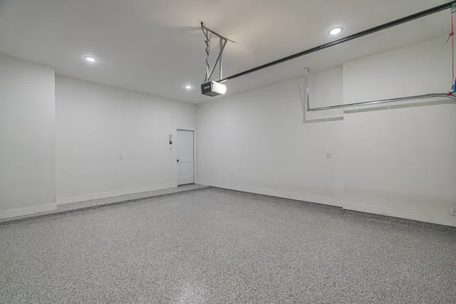 an empty room with a ceiling fan and a window