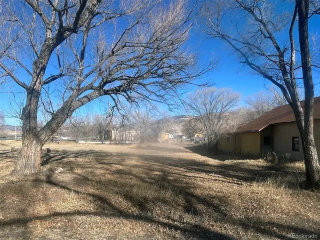 a view of yard covered with snow in front of house