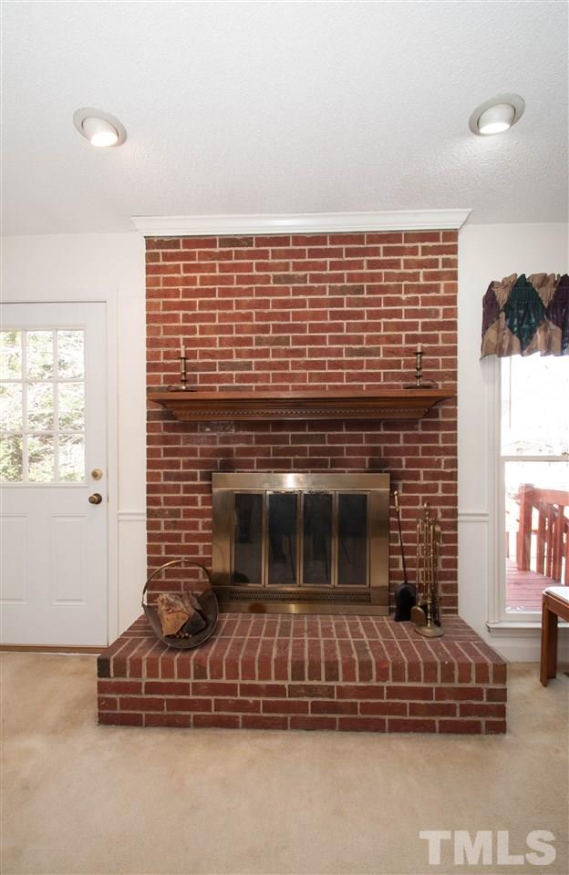 3517 Iron Sight Court Raleigh, NC 27616 - Photo 4 of 22 a living room with a fireplace