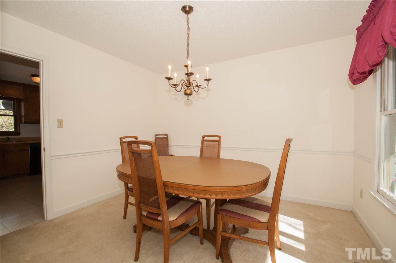 3517 Iron Sight Court Raleigh, NC 27616 - Photo 6 of 22 a view of a dining room with furniture and chandelier