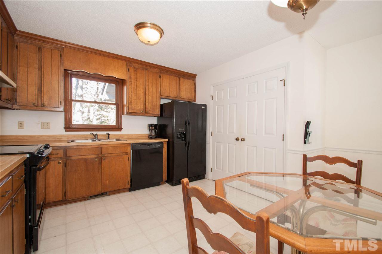 3517 Iron Sight Court Raleigh, NC 27616 - Photo 8 of 22 a kitchen with a refrigerator and a stove top oven