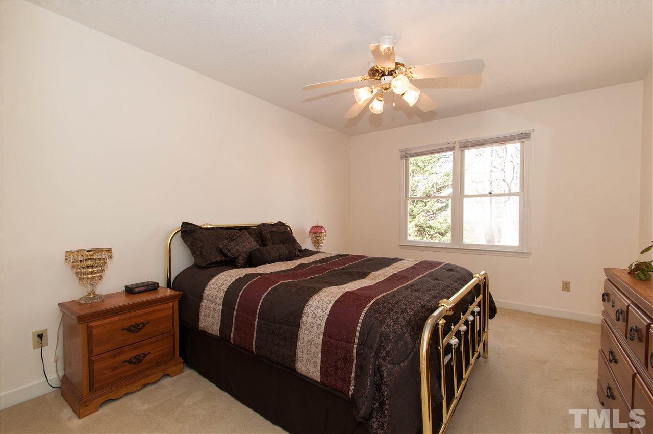 3517 Iron Sight Court Raleigh, NC 27616 - Photo 10 of 22 a bed sitting in a bedroom next to a window