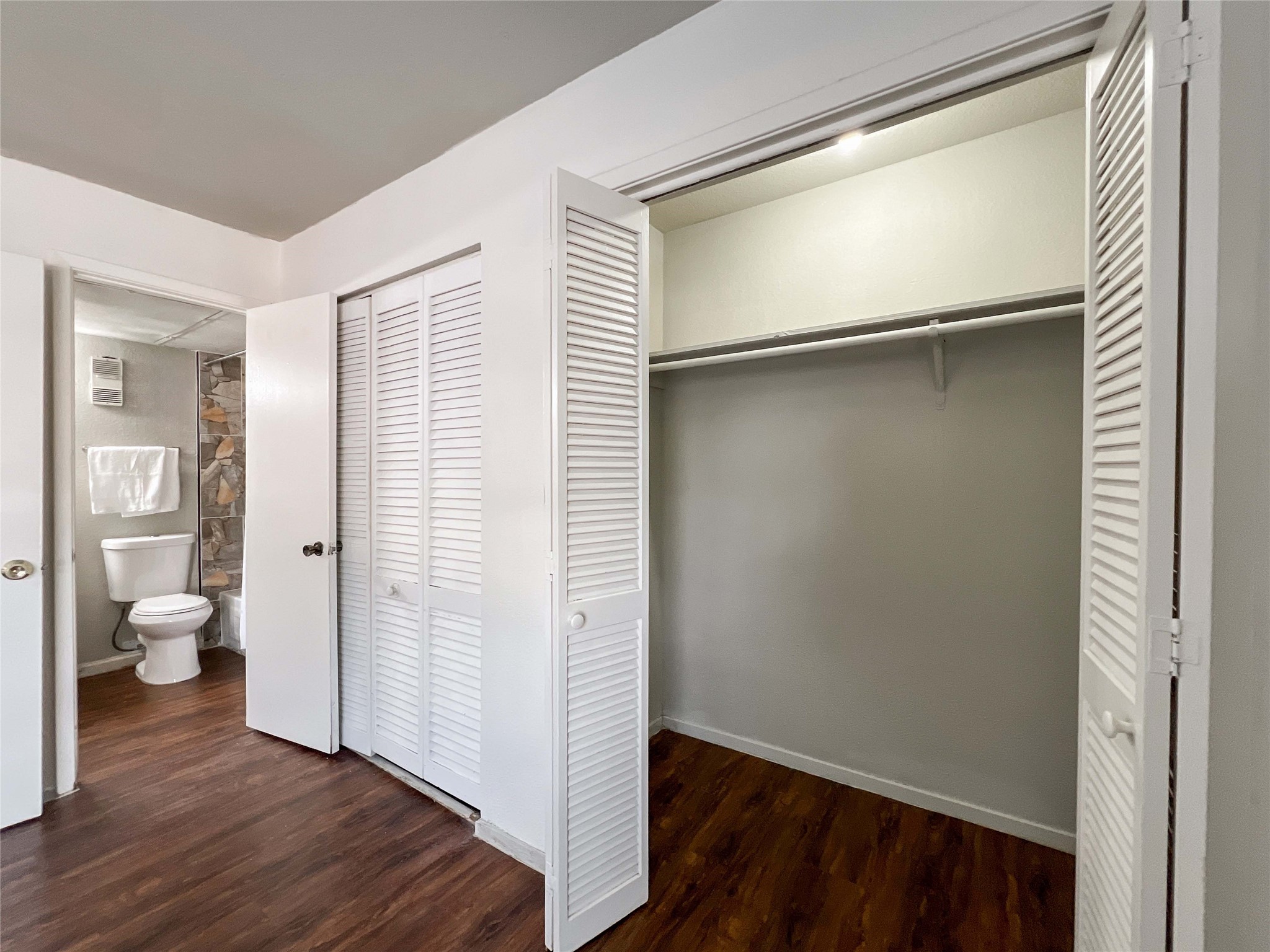 6001 Reims Road, Unit 1207 Houston, TX 77036 - Photo 11 of 18 a view of a room with wooden floor and a bathroom