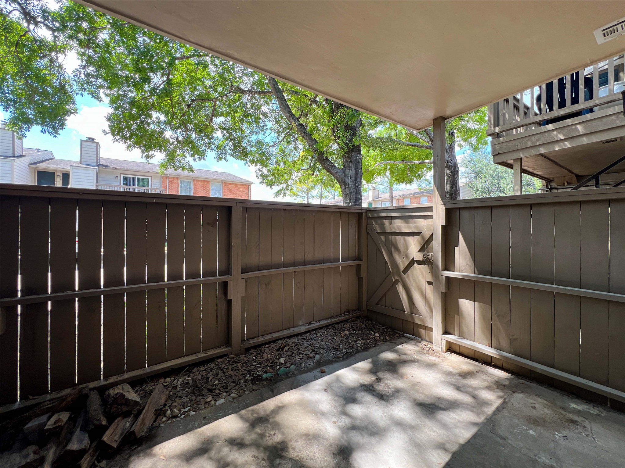 6001 Reims Road, Unit 1207 Houston, TX 77036 - Photo 15 of 18 a backyard of a house with lots of green space
