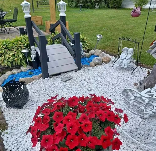 a backyard of a house with lots of green space