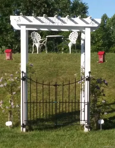 a view of a brick house with a yard