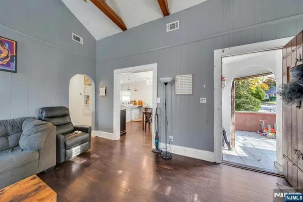 a living room with furniture and a gate