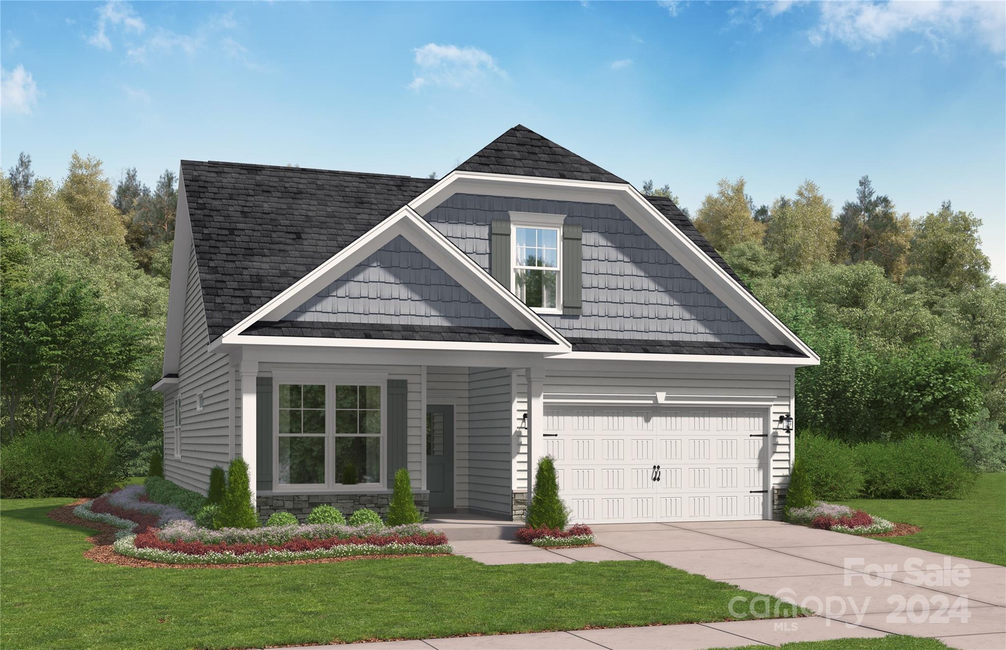 a front view of a house with a yard and potted plants