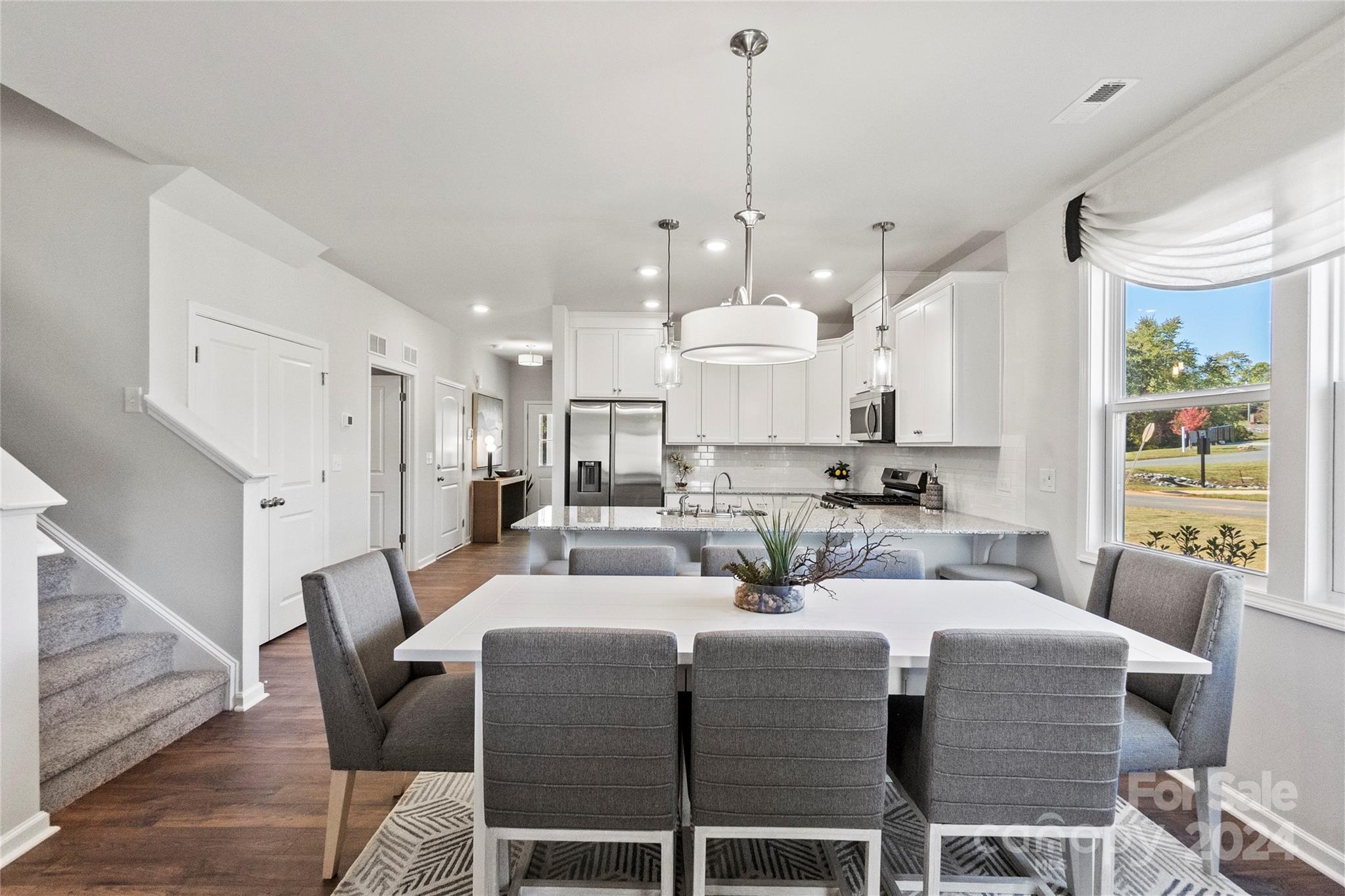 3182 Laurel Brook Drive Denver, NC 28037 - Photo 13 of 35 a large kitchen with a table and chairs