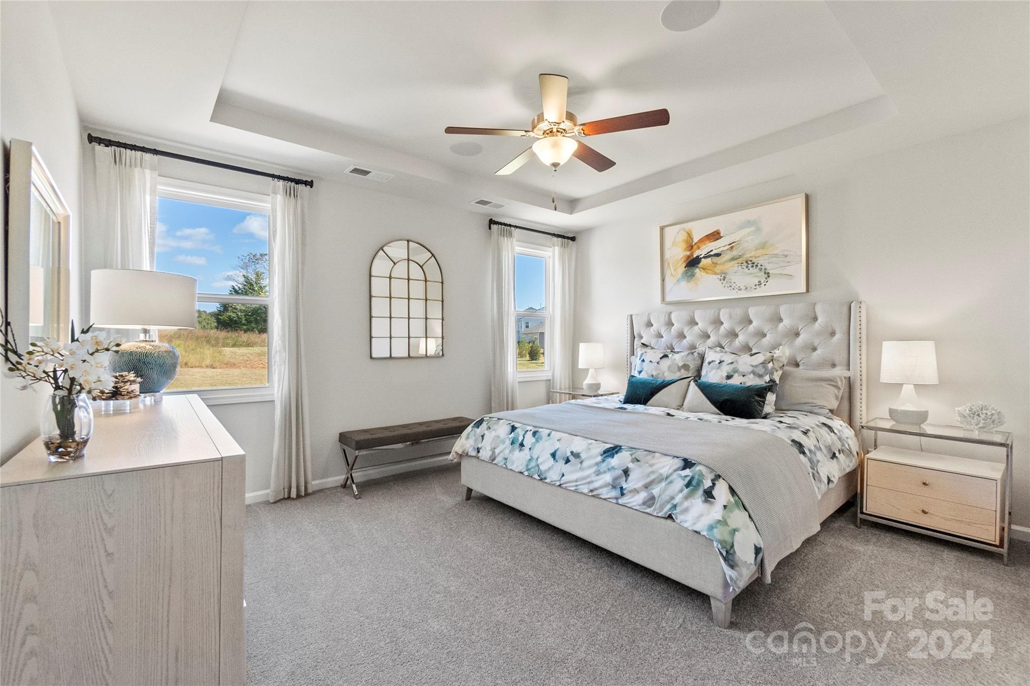 3182 Laurel Brook Drive Denver, NC 28037 - Photo 17 of 35 a bedroom with a large bed a chandelier and dresser
