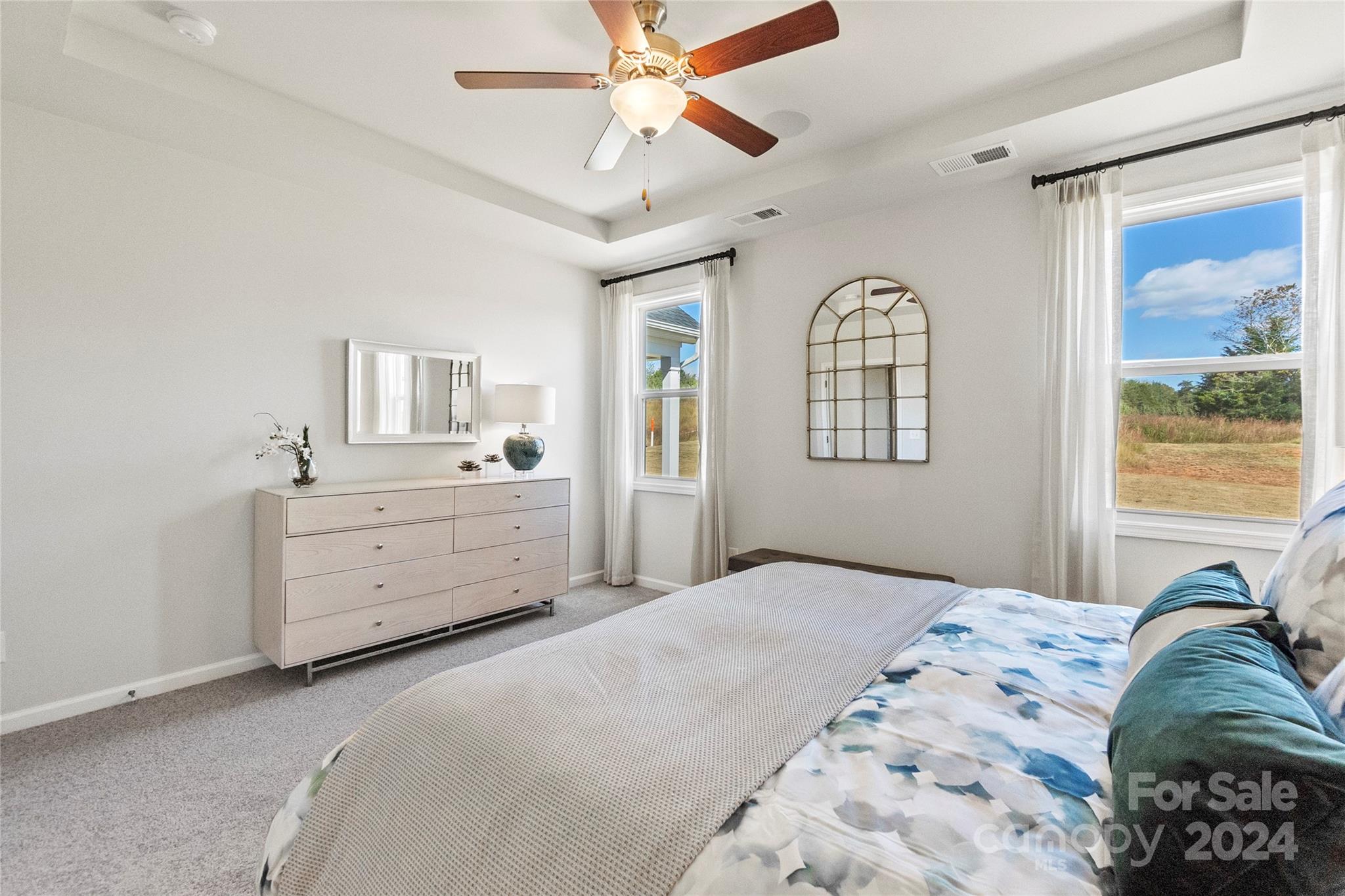 3182 Laurel Brook Drive Denver, NC 28037 - Photo 18 of 35 a bedroom with a bed next to a window and a dresser