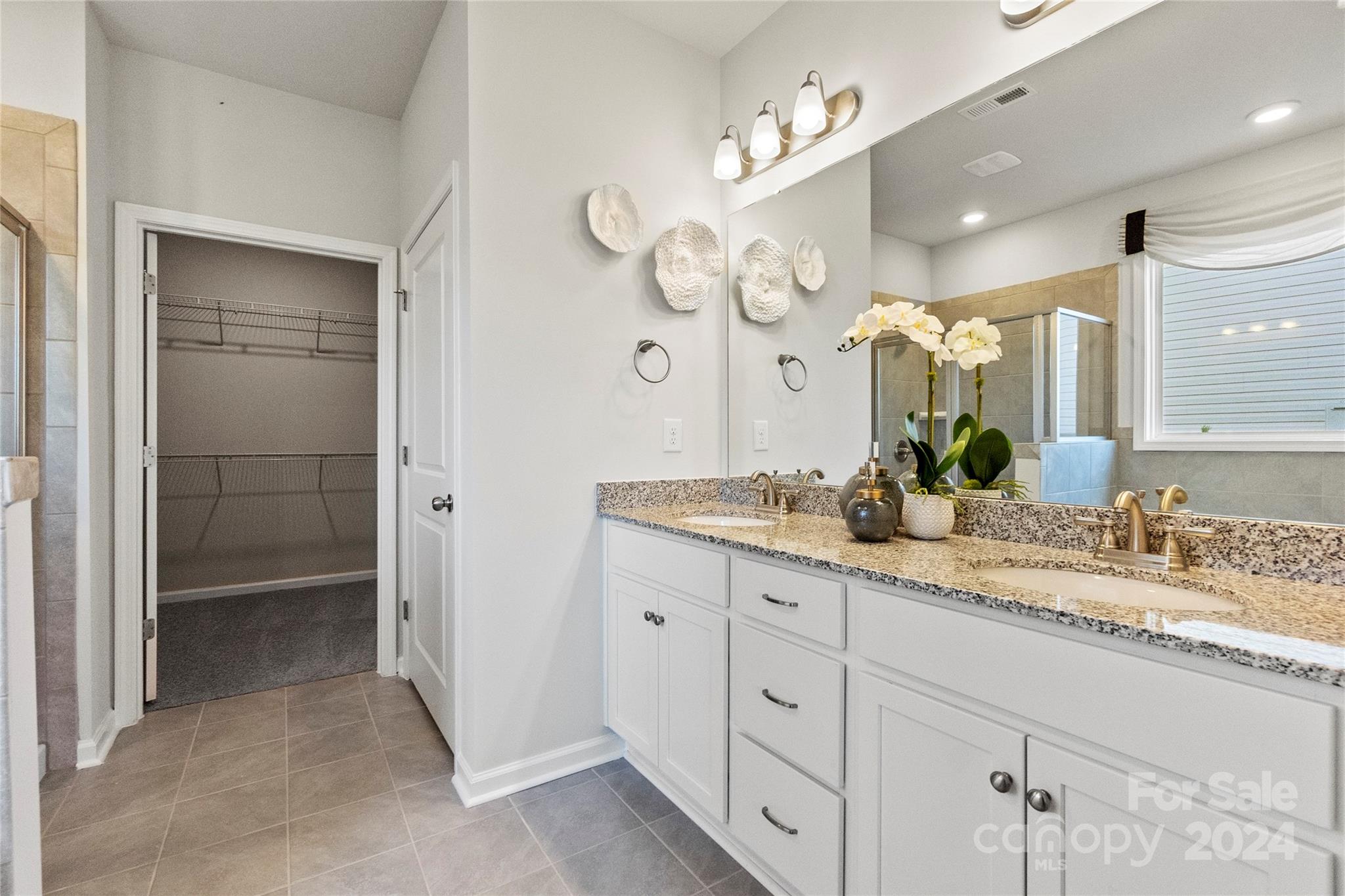 3182 Laurel Brook Drive Denver, NC 28037 - Photo 19 of 35 a spacious bathroom with a granite countertop sink mirror and shower