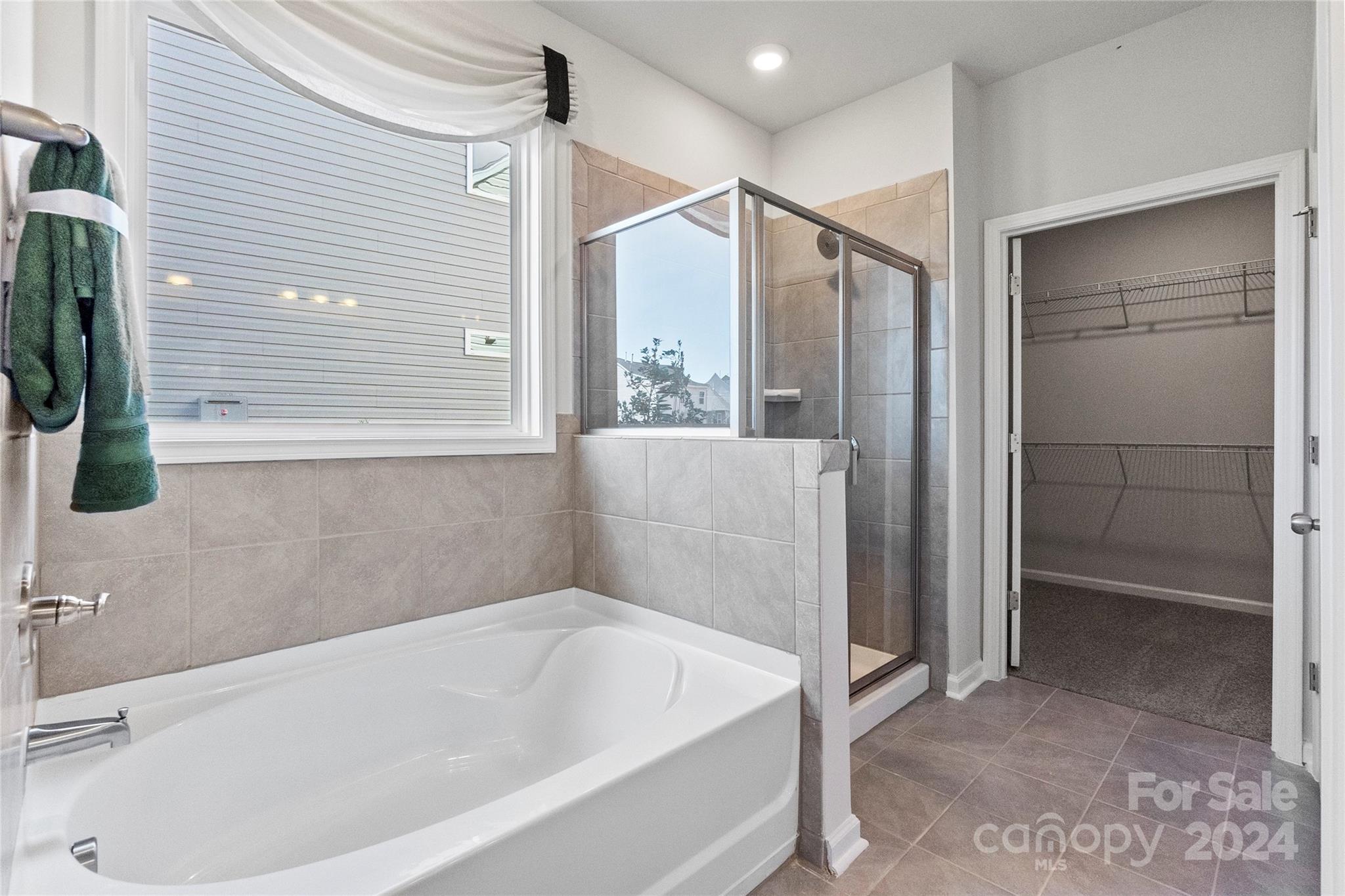 3182 Laurel Brook Drive Denver, NC 28037 - Photo 20 of 35 a bathroom with a tub and shower