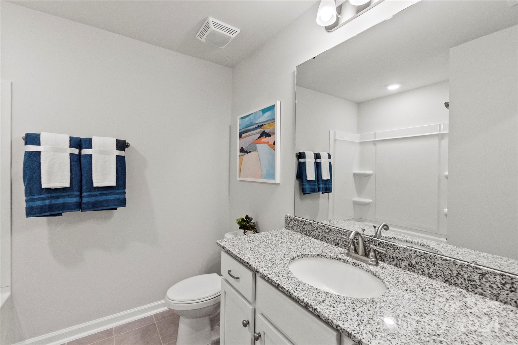 3182 Laurel Brook Drive Denver, NC 28037 - Photo 24 of 35 a bathroom with a granite countertop sink mirror vanity and toilet