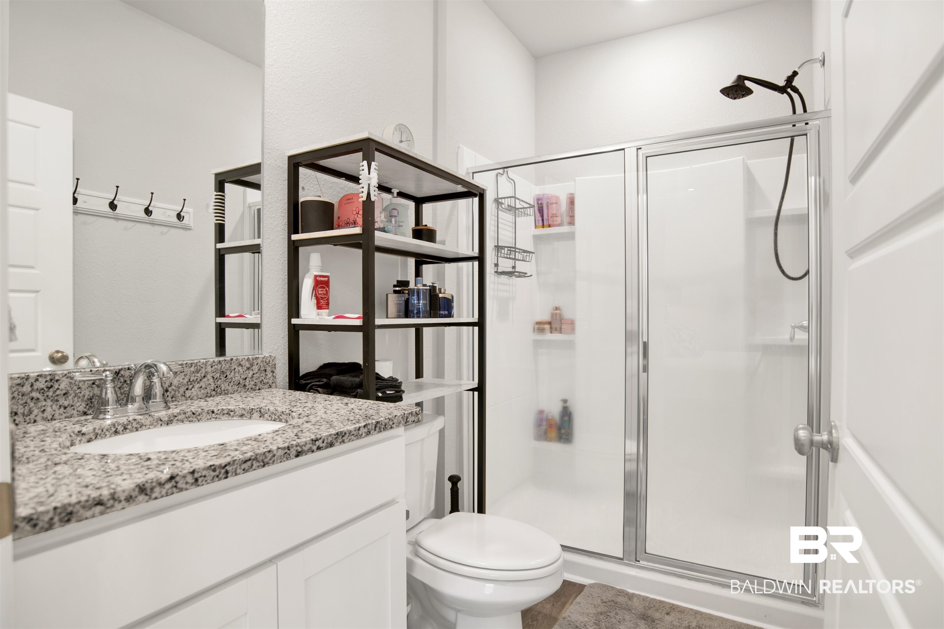 12813 Patriot Way Daphne, AL 36527 - Photo 9 of 23 Bathroom featuring a white vanity with a granite countertop, undermount sink, and chrome faucet