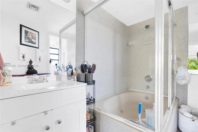 a bathroom with a sink and a bathtub