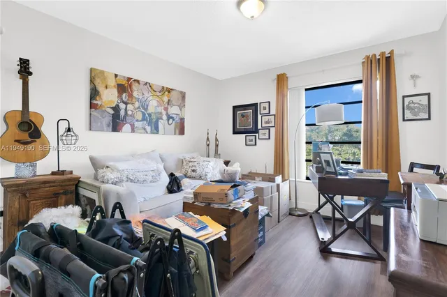 a living room with furniture and a window