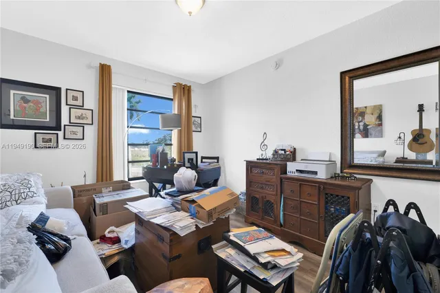 a living room with furniture and a window