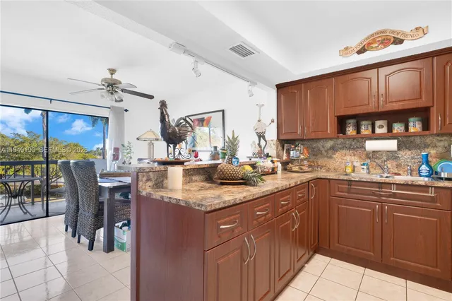 a kitchen with stainless steel appliances granite countertop a sink and cabinets