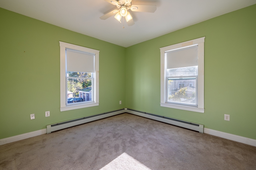 151 R Methuen Street, Unit 151R Lowell, MA 01850 - Photo 9 of 15 a view of an empty room with a window and closet area