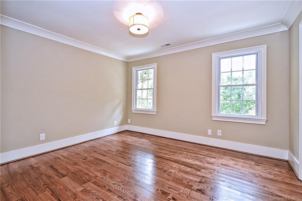 380 Point Carpenter Road Fort Mill, SC 29707 - Photo 14 of 23 an empty room with wooden floor and windows