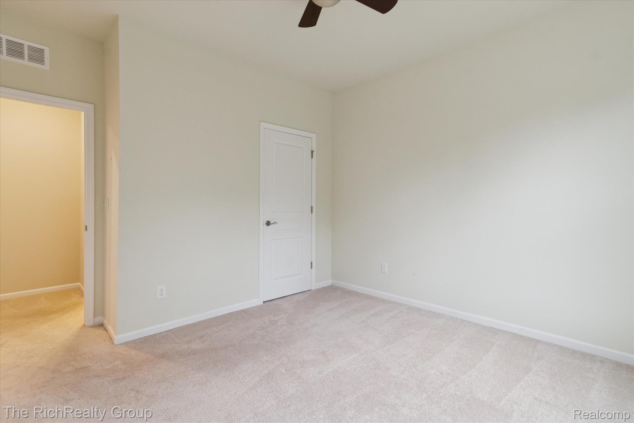 49534 Mapleton Road Canton, MI 48188 - Photo 27 of 37 Unfurnished bedroom featuring light carpet and ceiling fan