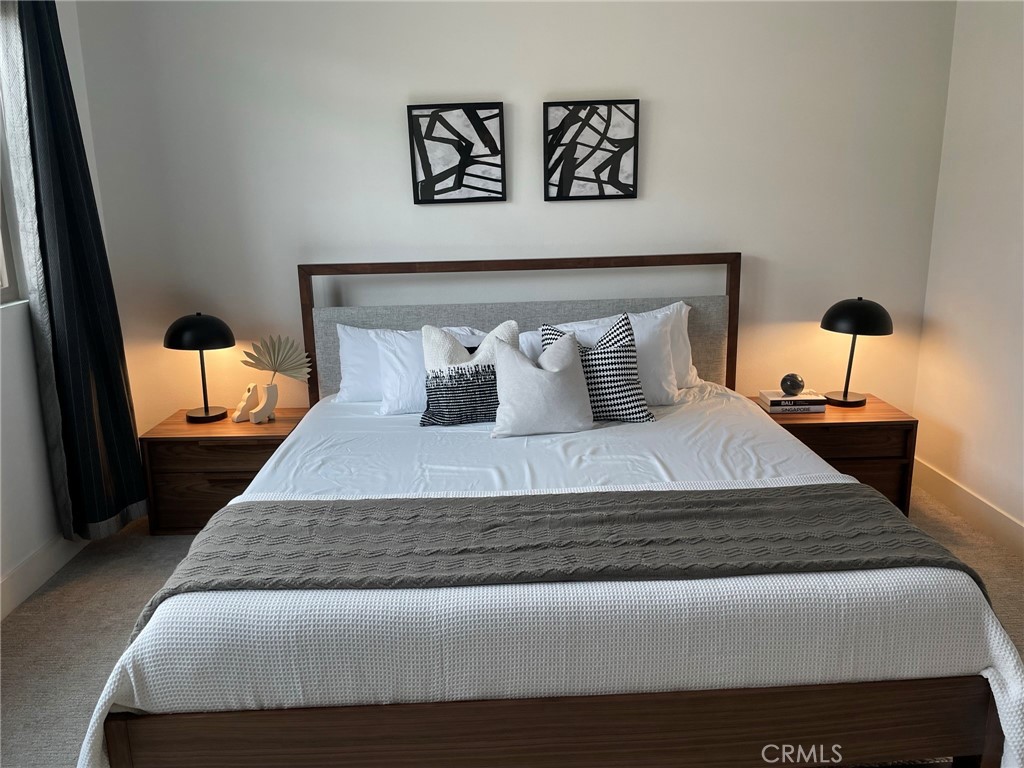 37 Soho Irvine, CA 92612 - Photo 7 of 11 a bedroom with a bed and painting on the wall