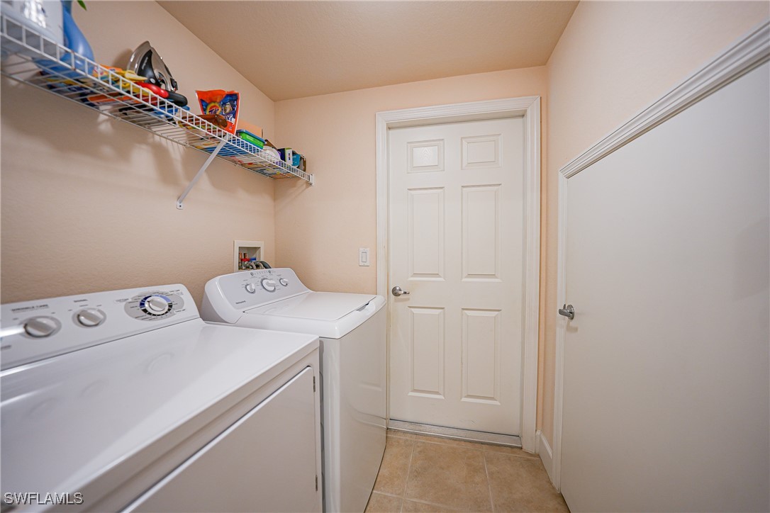 17084 Acapulco Road, Unit 211 Punta Gorda, FL 33955 - Photo 17 of 45 a utility room with dryer and washer