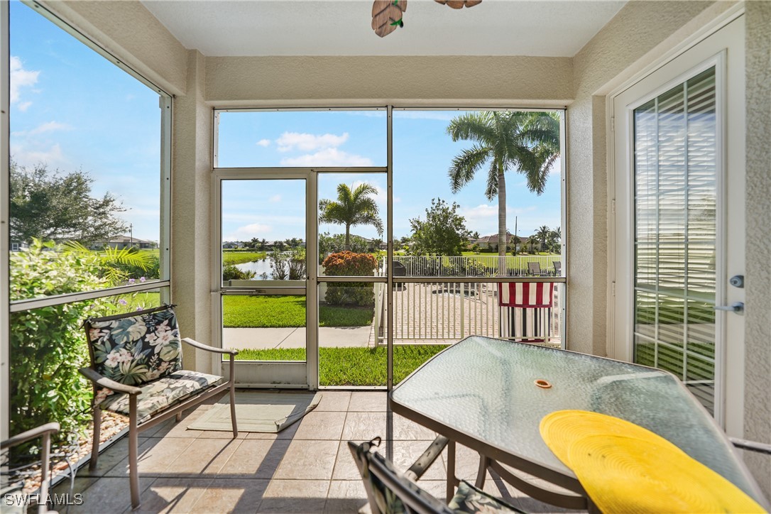 17084 Acapulco Road, Unit 211 Punta Gorda, FL 33955 - Photo 2 of 45 a view of a swimming pool with furniture