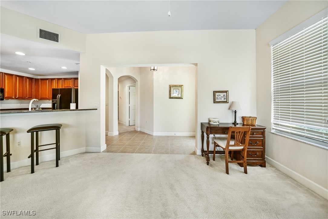 17084 Acapulco Road, Unit 211 Punta Gorda, FL 33955 - Photo 22 of 45 a view of a livingroom with furniture and a window