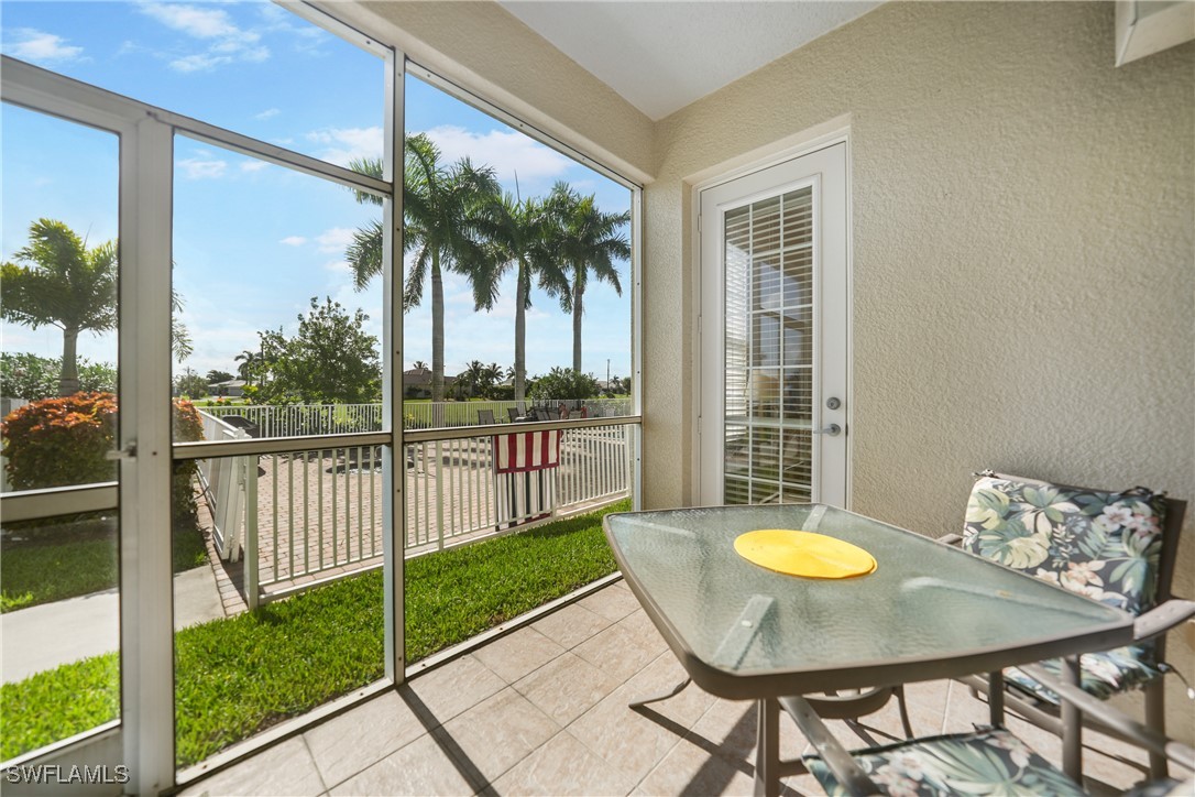 17084 Acapulco Road, Unit 211 Punta Gorda, FL 33955 - Photo 25 of 45 a view of a dining room with furniture window and wooden floor