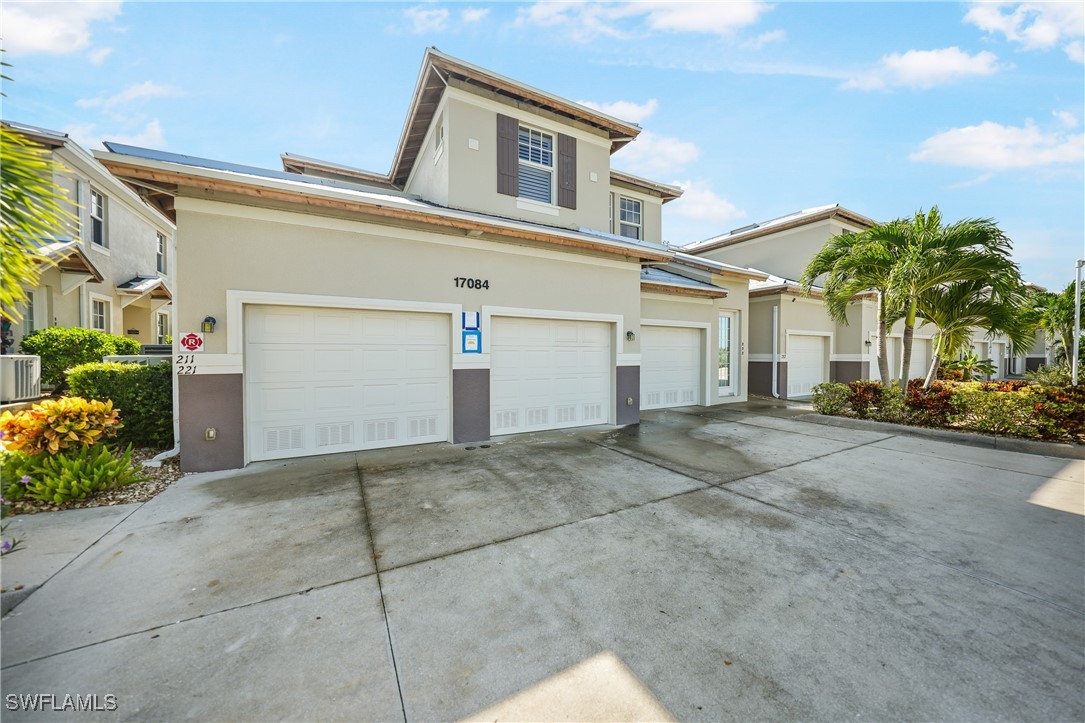 17084 Acapulco Road, Unit 211 Punta Gorda, FL 33955 - Photo 30 of 45 a view of a street with potted plants