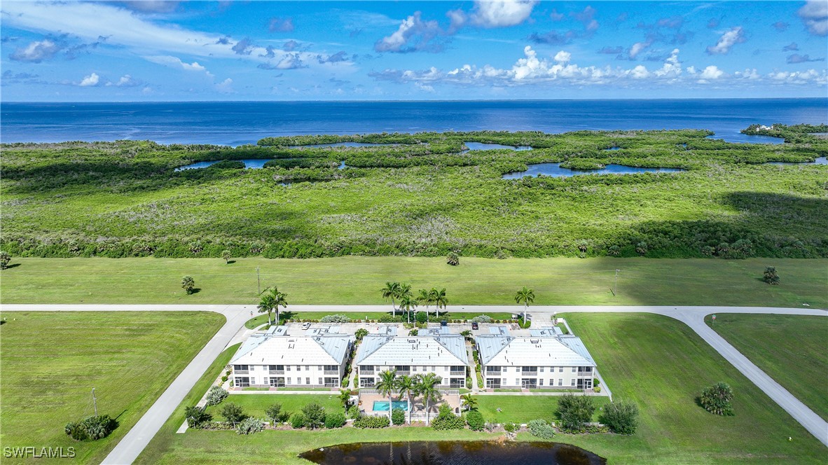 17084 Acapulco Road, Unit 211 Punta Gorda, FL 33955 - Photo 34 of 45 a view of an outdoor space and a lake view