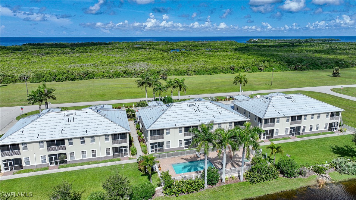 17084 Acapulco Road, Unit 211 Punta Gorda, FL 33955 - Photo 37 of 45 a view of a house with a big yard