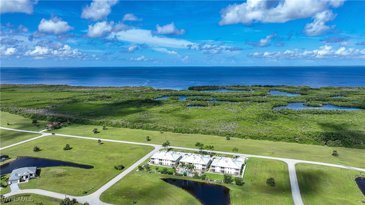 17084 Acapulco Road, Unit 211 Punta Gorda, FL 33955 - Photo 38 of 45 a view of a tennis court