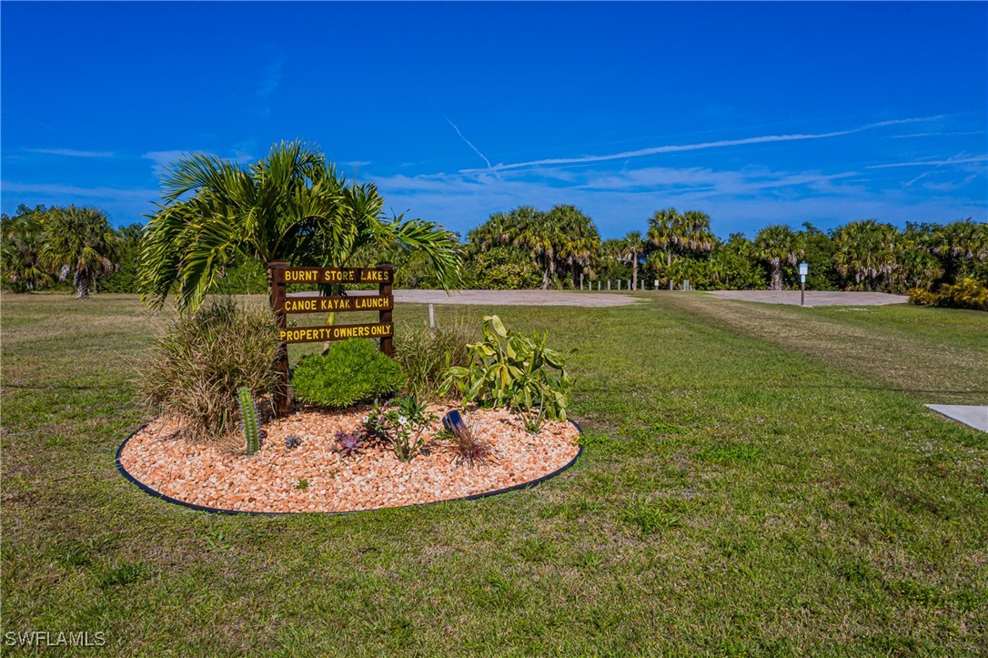 17084 Acapulco Road, Unit 211 Punta Gorda, FL 33955 - Photo 44 of 45 a view of a lake in front of house with outdoor seating